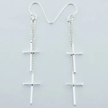 Sterling silver double dangle cross earrings.