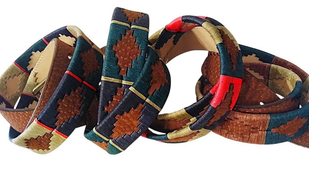 Embroidered polo belts featuring Pampa guard motifs with colorful waxed threads, offering a unique and stylish accessory for any outfit.
