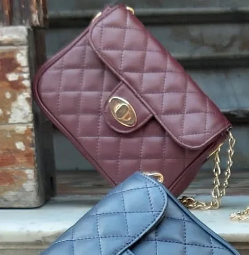 blue and plum chanel style leather handbag with golden chain as shoulder stripe