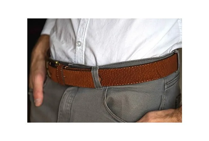 Carpincho capybara hide belt with brass buckle on man model.