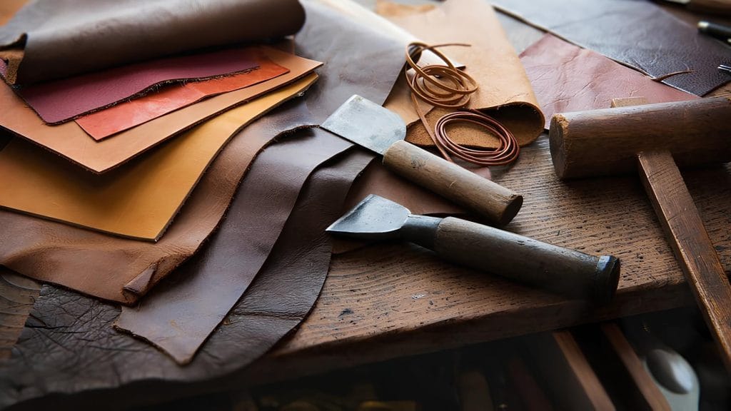 Argentine cowhides laying flat on crafting table.