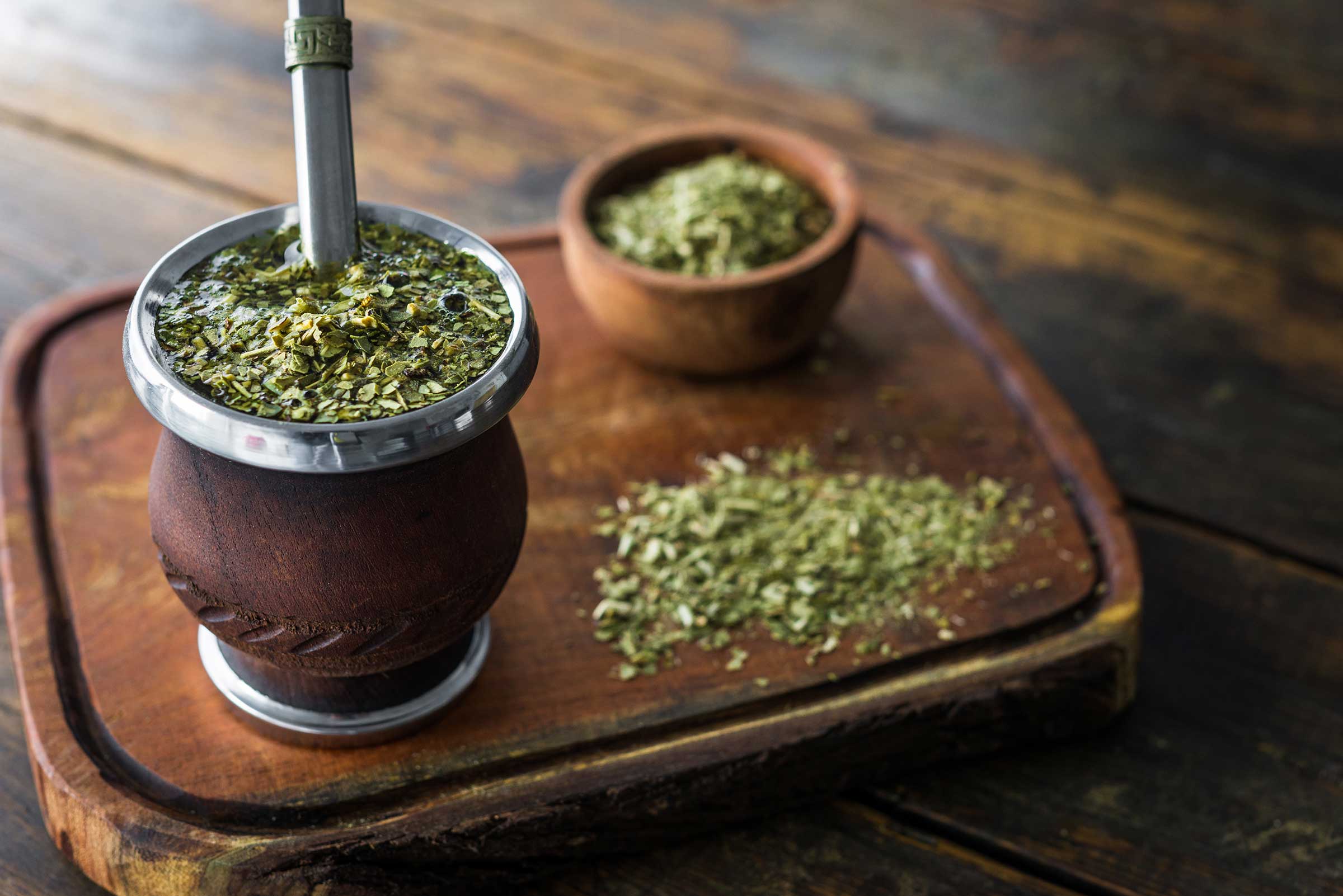Traditional Argentinian yerba mate tea in calabash gourd with bombilla stick