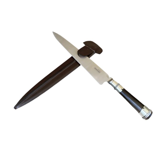 Handcrafted Argentine Gaucho facon knife with silver adornments.