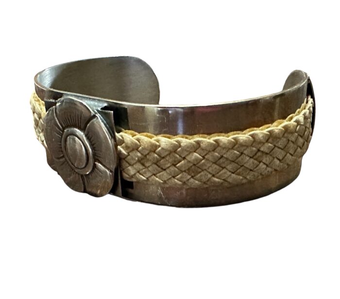 Alpaca Silver Cuff Style Bracelet with Rawhide Leather Braiding and Scalloped Flower Motif.