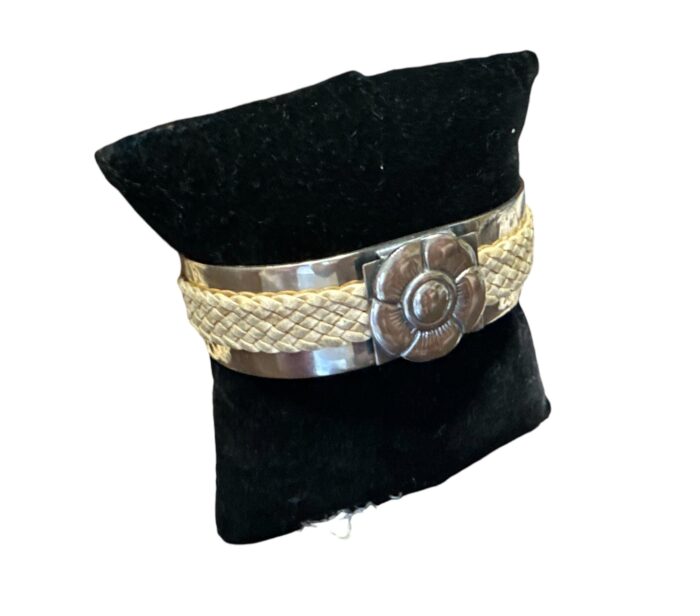 Alpaca Silver Cuff Style Bracelet with Rawhide Leather Braiding and Scalloped Flower Motif.