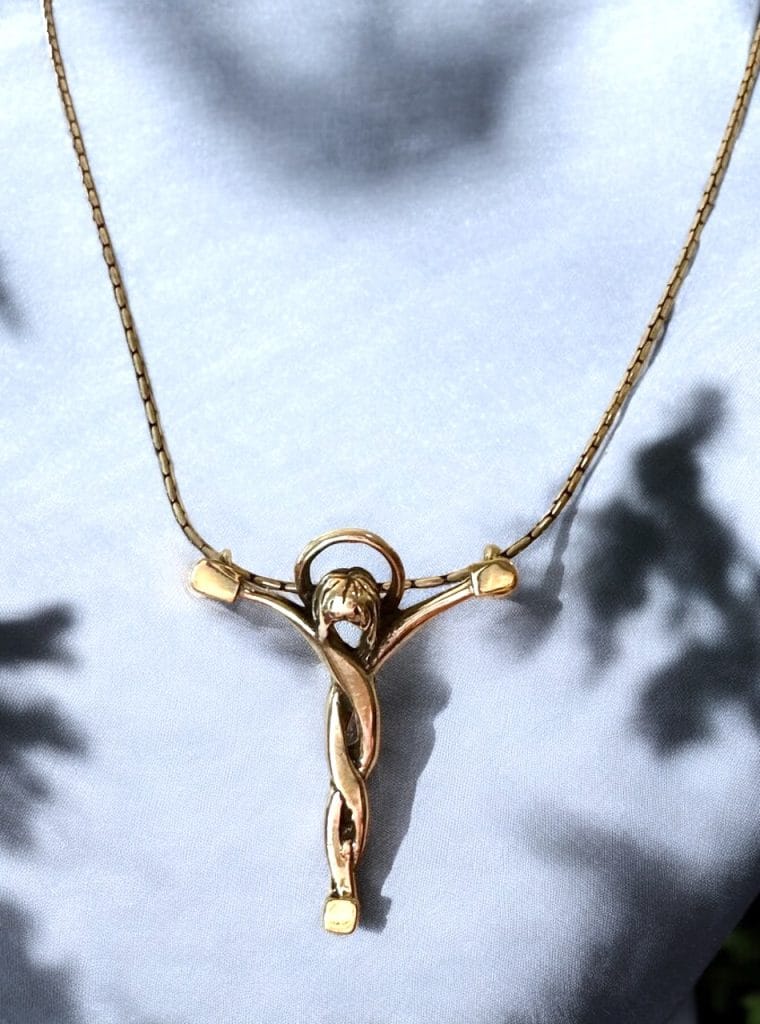 Christ pendant of solid sterling silver with 18K gold.