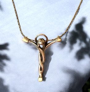 Christ pendant of solid sterling silver with 18K gold.