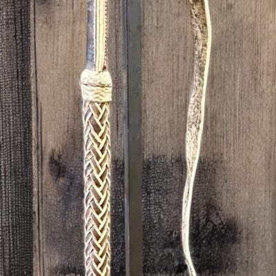 Braided leather riding crop.