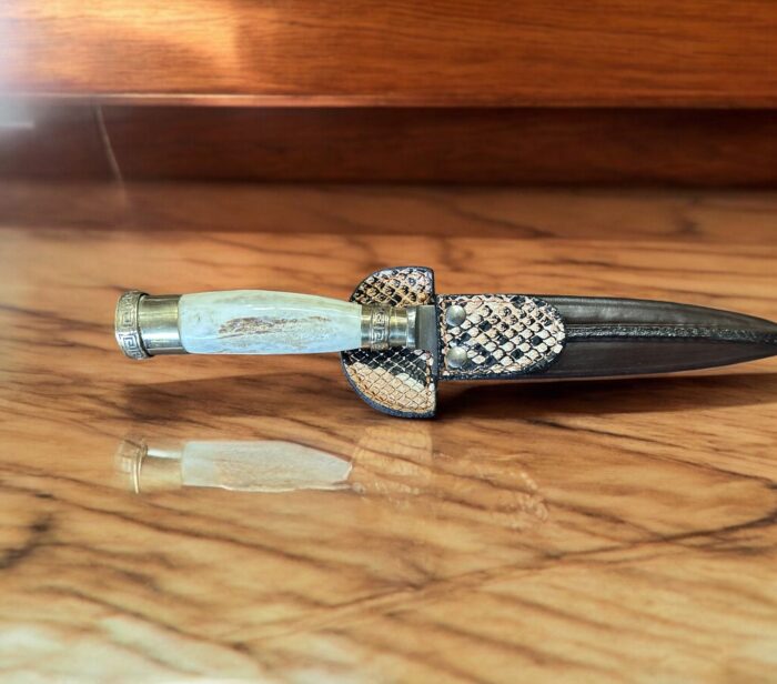 Argentine-made knife with a full tang stainless steel blade, staghorn handle, and engraved nickel silver bolster, crafted with precision.