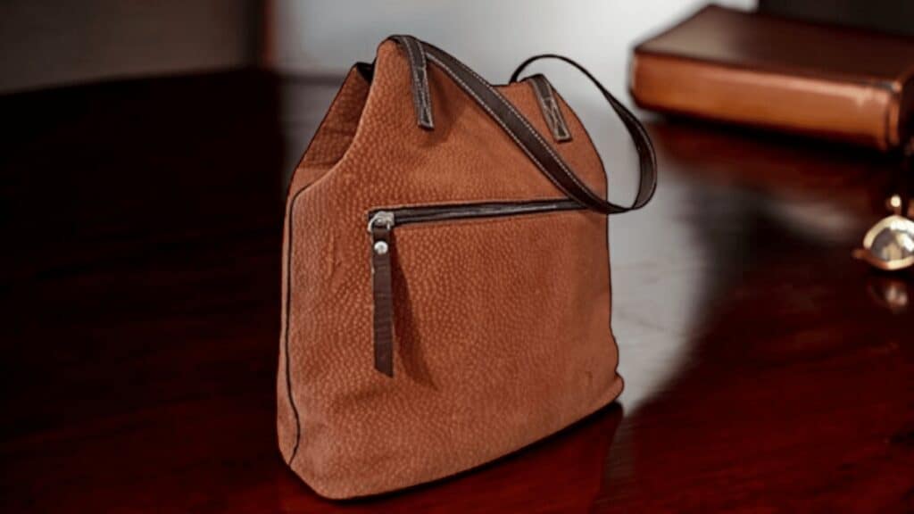 A close-up of an exclusive capybara leather tote bag, featuring classic craftsmanship, rich texture, and elegant design with old money vibes, perfect for elevating any sophisticated outfit.