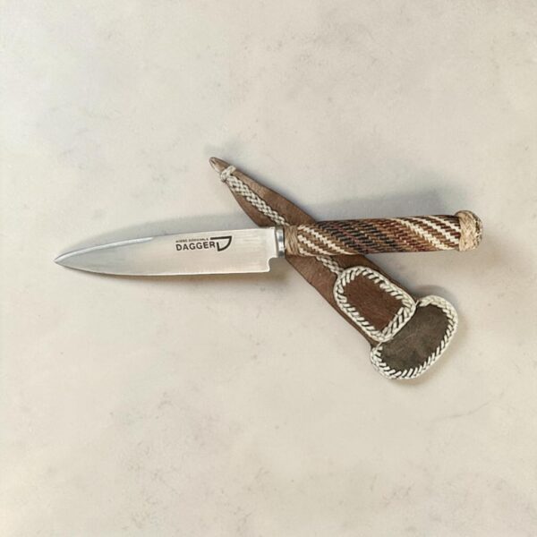 Gaucho knife with braided rawhide handle crossed over leather sheath, 12 cm blade