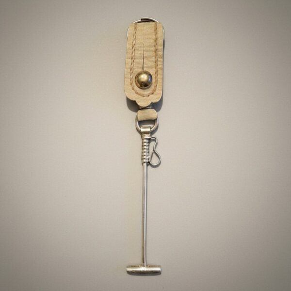 Handmade Argentine polo mallet keychain crafted in rawhide leather with alpaca silver detail