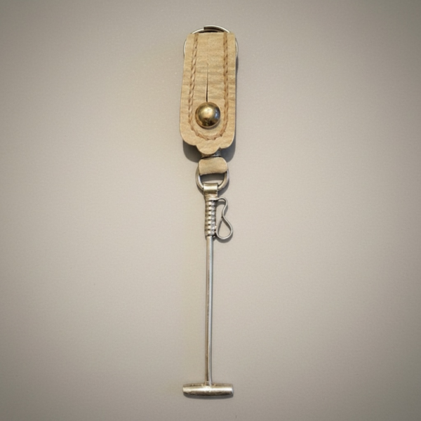 Handmade Argentine polo mallet keychain crafted in rawhide leather with alpaca silver detail