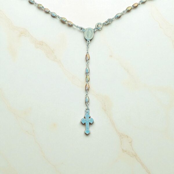 Close-up of 925 silver rosary necklace featuring sterling silver, rose gold-plated, and yellow gold-plated beads, displayed on a white marble surface