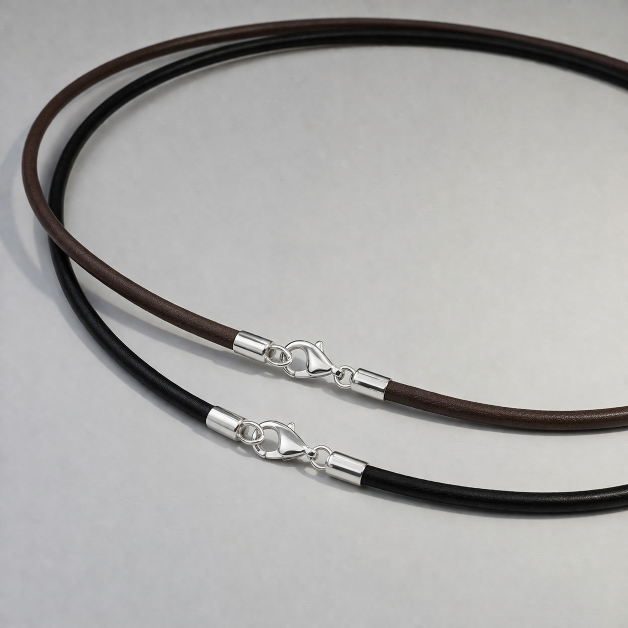 Black and brown leather chokers with sterling silver clasps