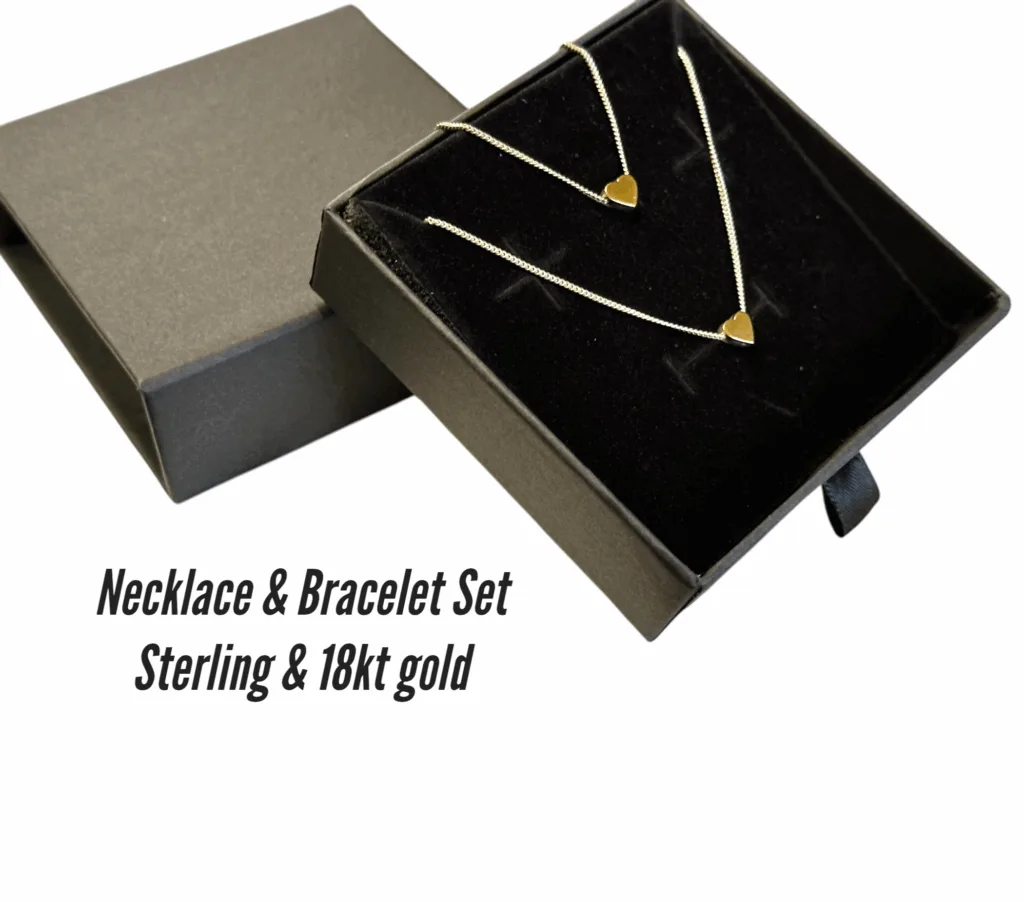Reversible 3D heart bracelet and necklace set in sterling silver and 18k gold, elegantly presented in gift box, perfect luxury gift for women