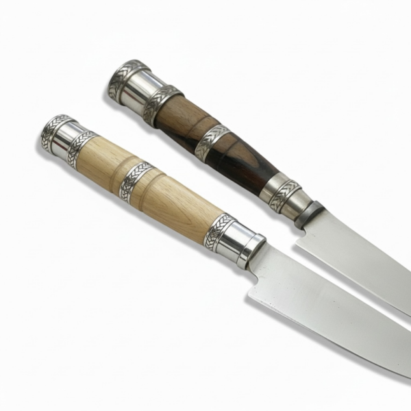 Handcrafted gaucho knife showing dark wood and natural blond wood handle variations with engraved alpaca silver fittings.