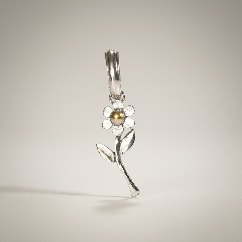 Sterling silver flower pendant with gold center, silver bail, stem and leaves