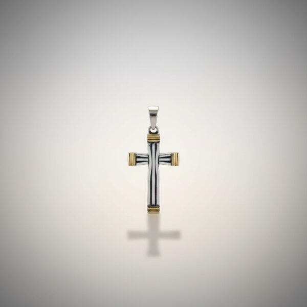 Cross pendant in sterling silver with gold accents on a clean background
