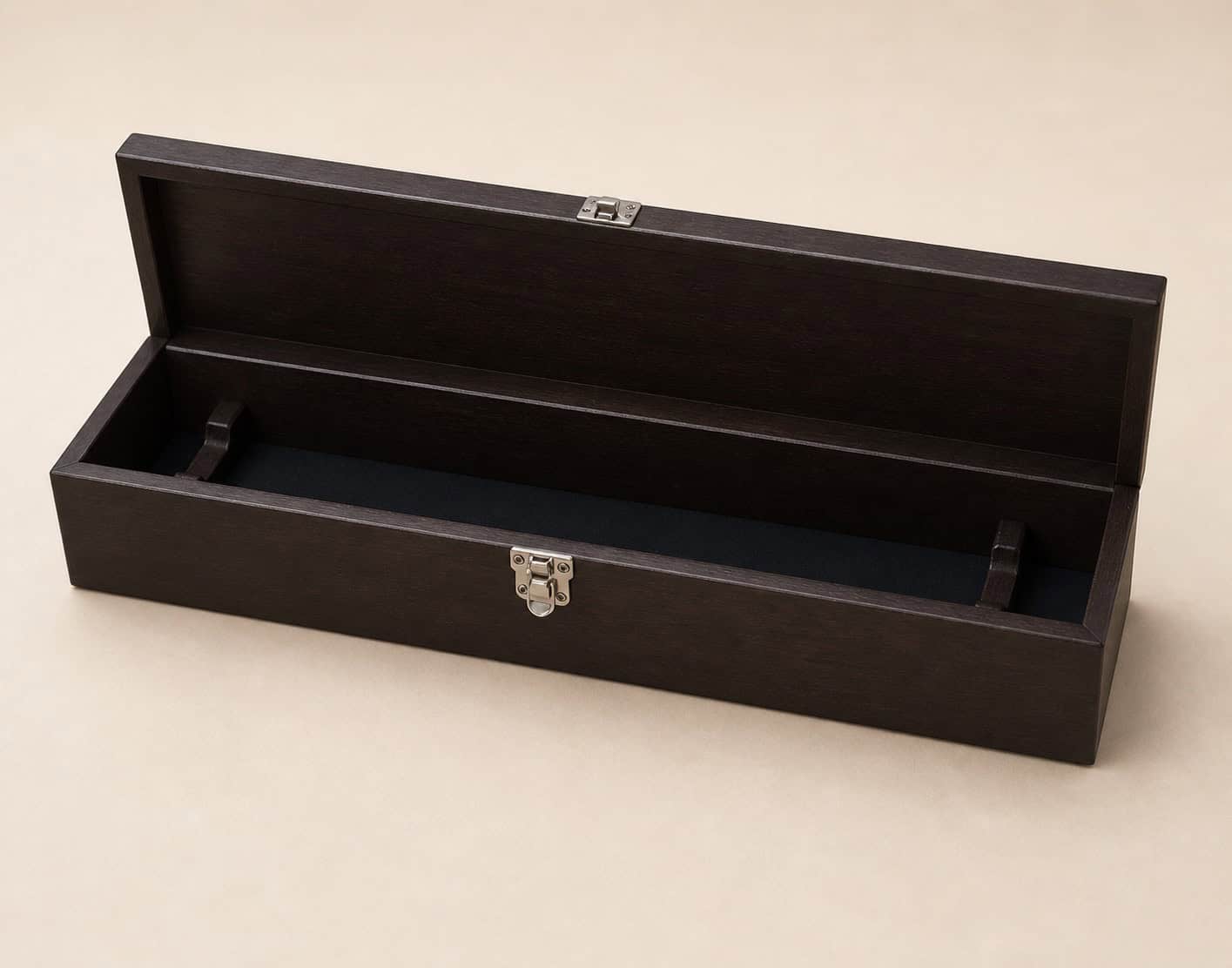 Open dark wooden knife presentation box with chrome clasp and black interior lining