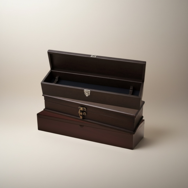 Three wooden knife presentation boxes stacked showing chrome clasp, antique brass clasp, and no clasp designs