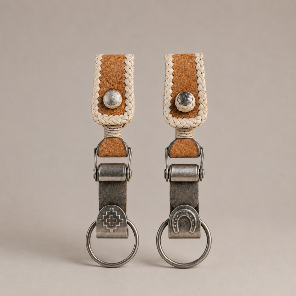 Argentine capybara leather keychain with horseshoe motif and hand-braided rawhide detail