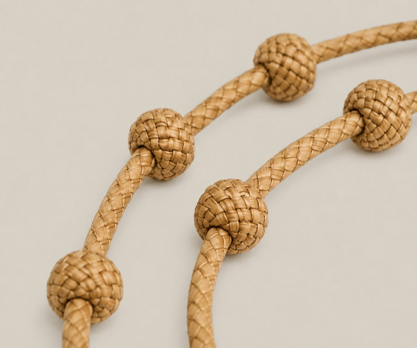 Close-up of hand-braided counting knots on a handmade Argentine rawhide cattle counter keychain crafted using traditional gaucho techniques.