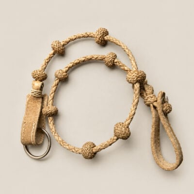 Handmade Argentine rawhide cattle counter keychain featuring traditional gaucho braiding, livestock counting knots, and genuine rawhide leather craftsmanship.