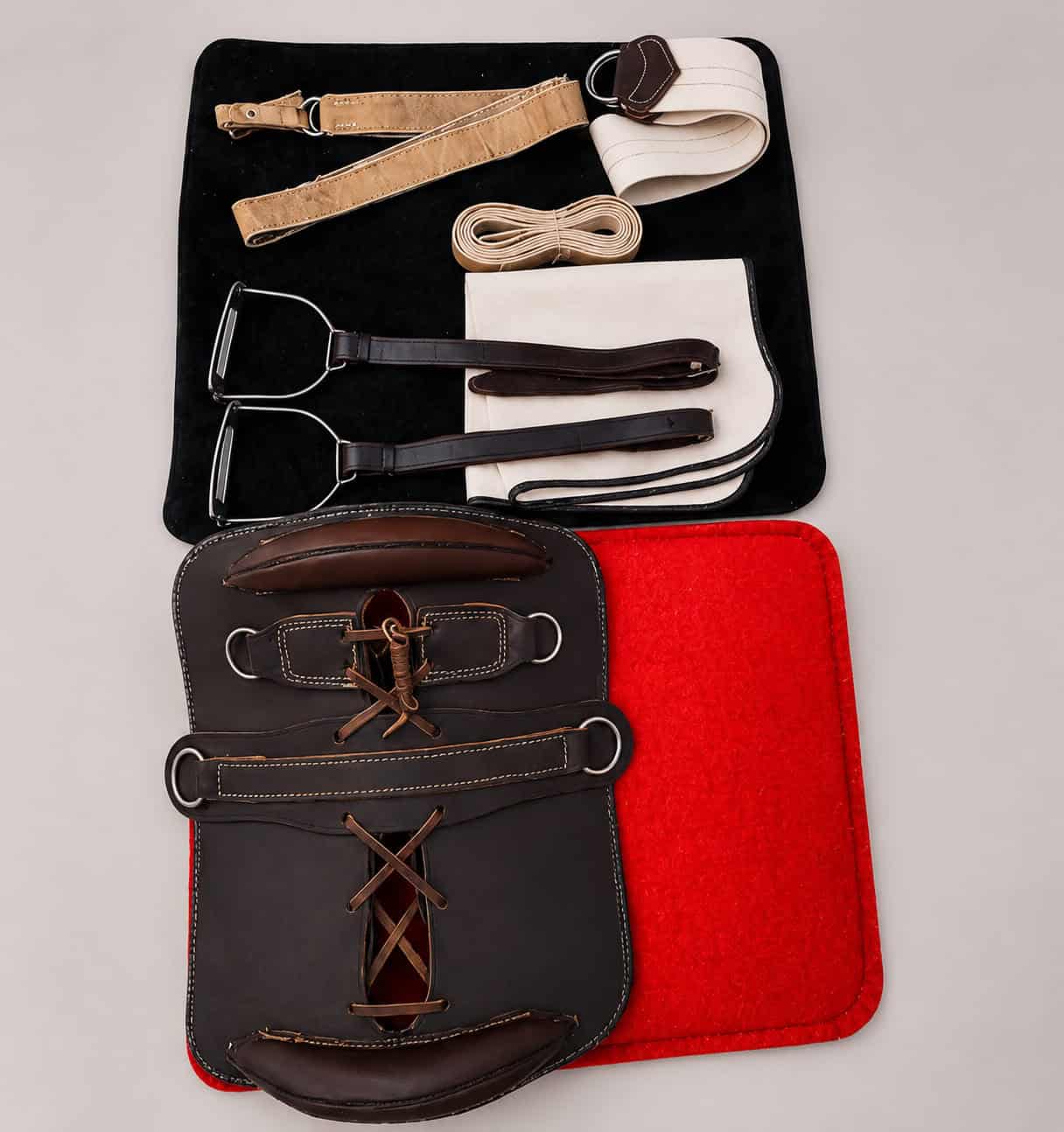 Traditional Argentine Recado Criollo saddle components arranged as a complete gaucho saddle set