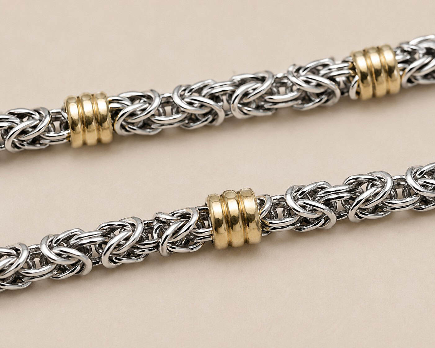 Close-up of a Byzantine sterling silver chain with genuine Dublee gold accents and hand-applied patina.