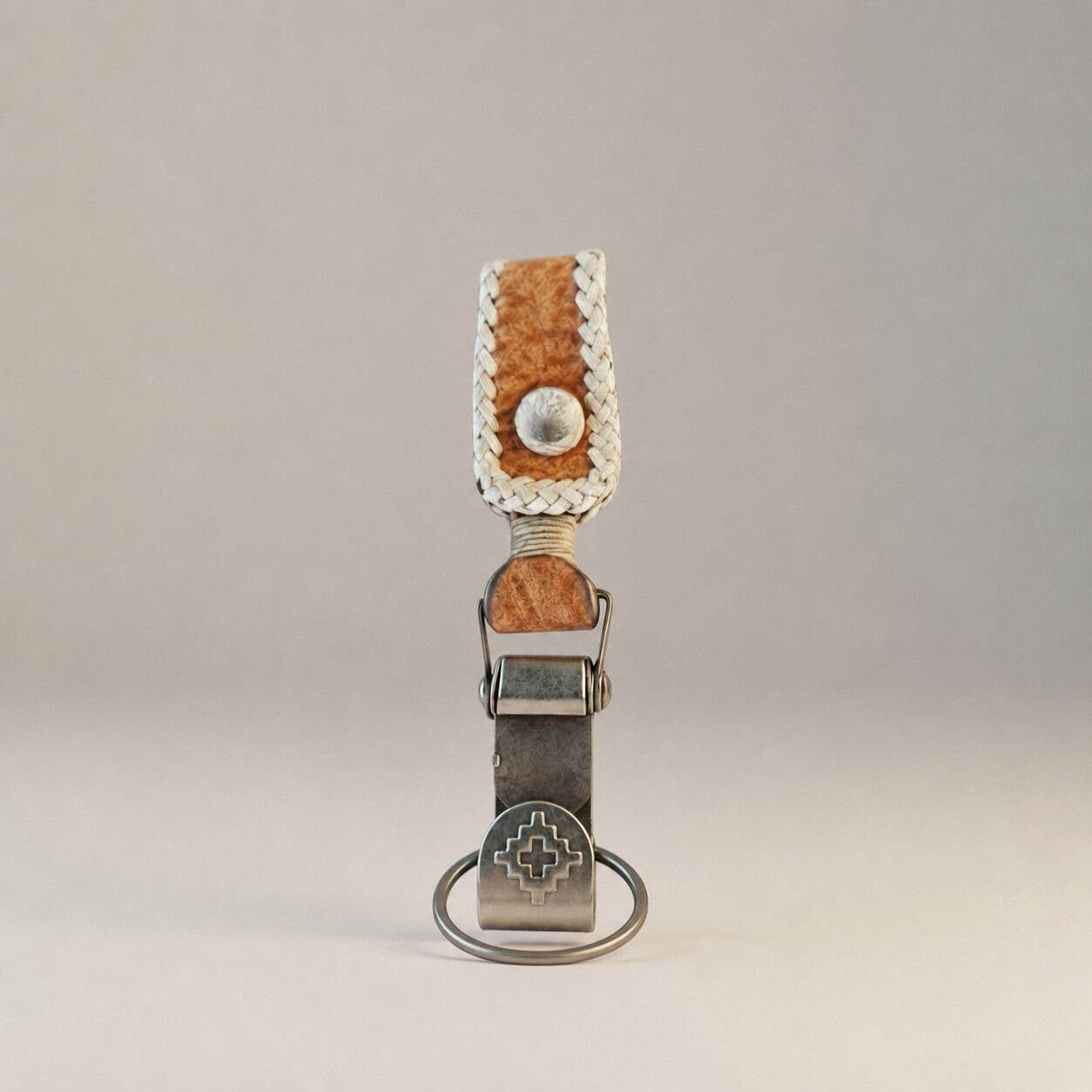 Argentine capybara leather keychain featuring traditional Guarda Pampa pattern and brass hardware