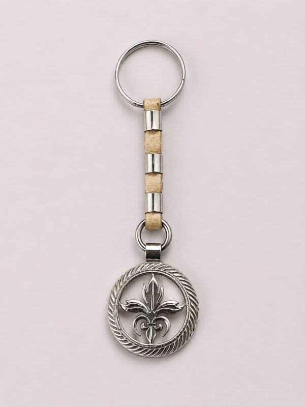 Handcrafted Fleur-de-Lis Alpaca silver and rawhide leather keychain from Argentina.