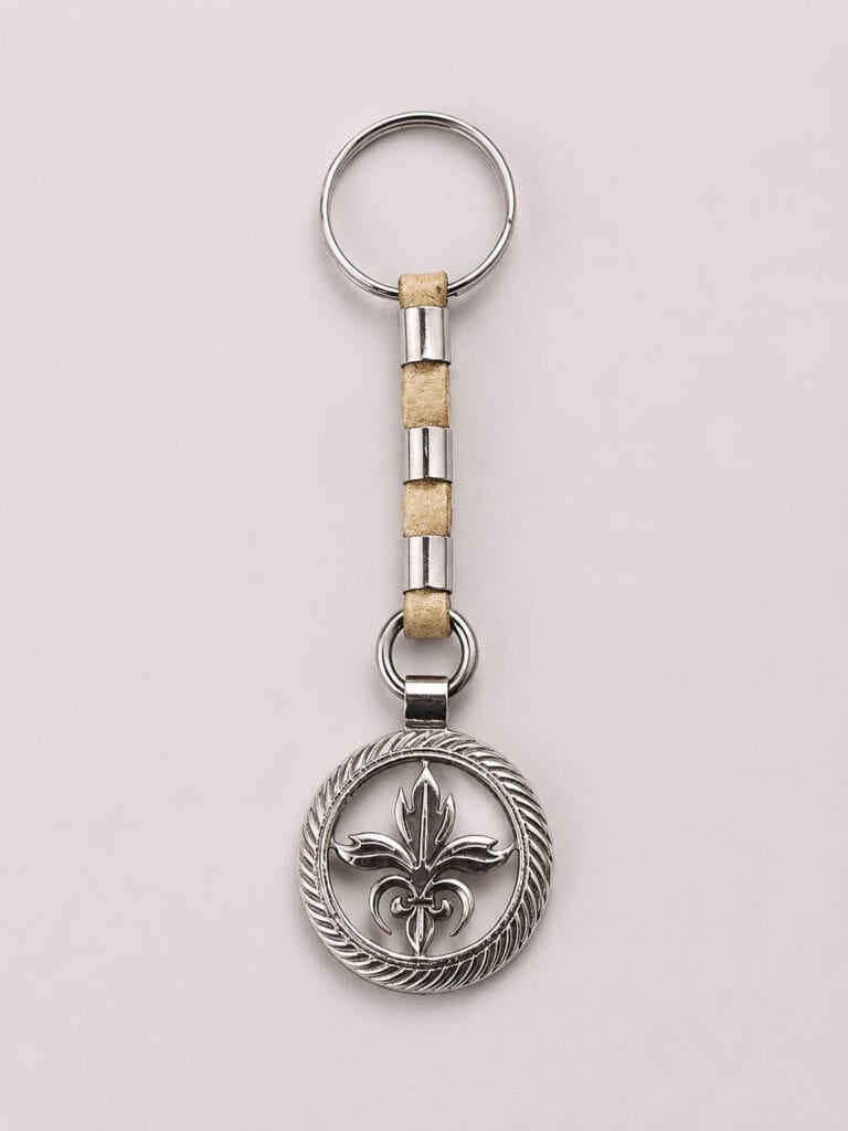 Handcrafted Fleur-de-Lis Alpaca silver and rawhide leather keychain from Argentina.