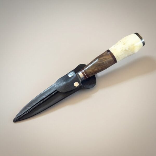 Handmade gaucho knife with polished bone and exotic hardwood handle and stainless steel blade