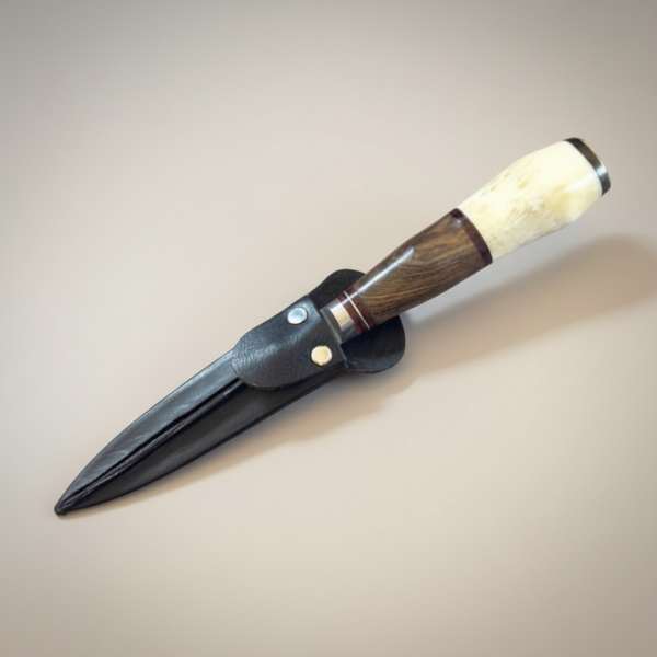 Handmade gaucho knife with polished bone and exotic hardwood handle and stainless steel blade
