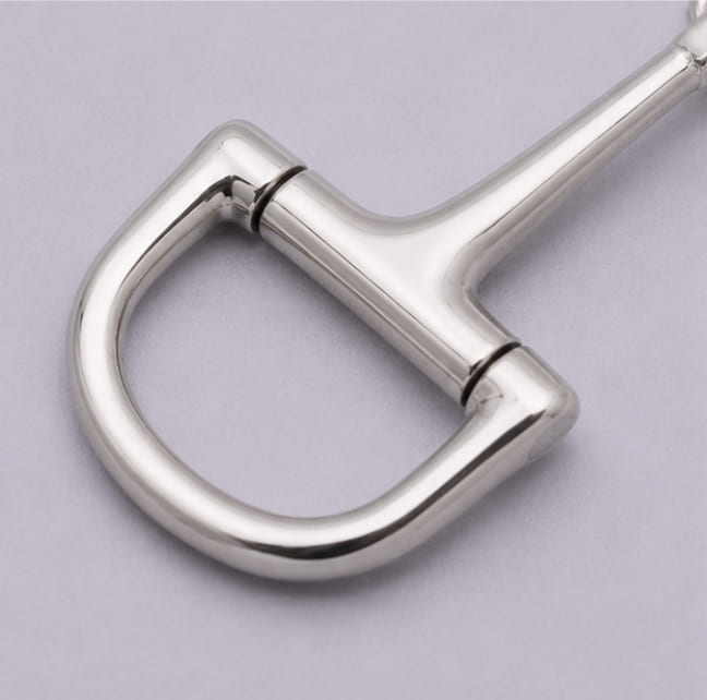 Close-up of the polished heavy chrome D-ring on the equestrian keychain.