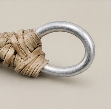 Detail of the stainless steel ring on a handmade Argentine rawhide lasso.