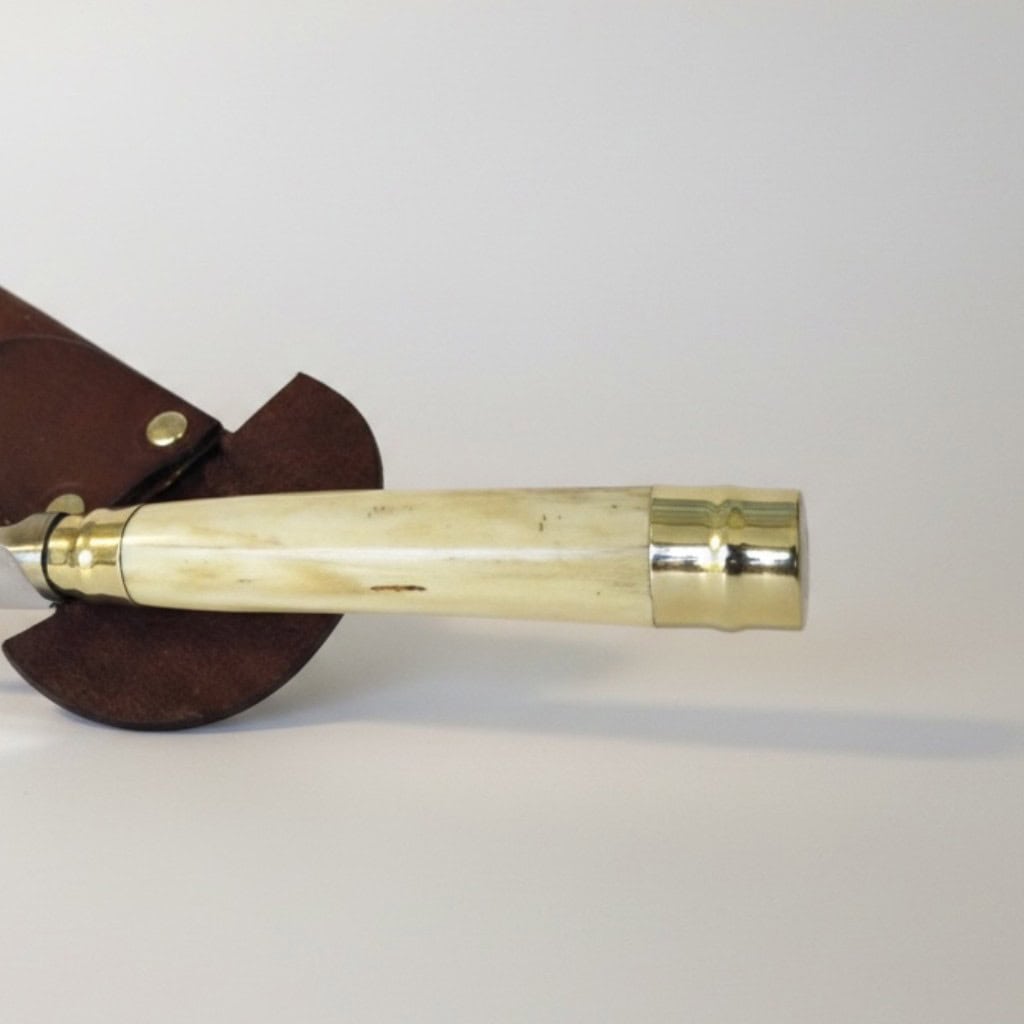 Close-up of polished antler gaucho knife handle with alpaca silver and twisted wire detail
