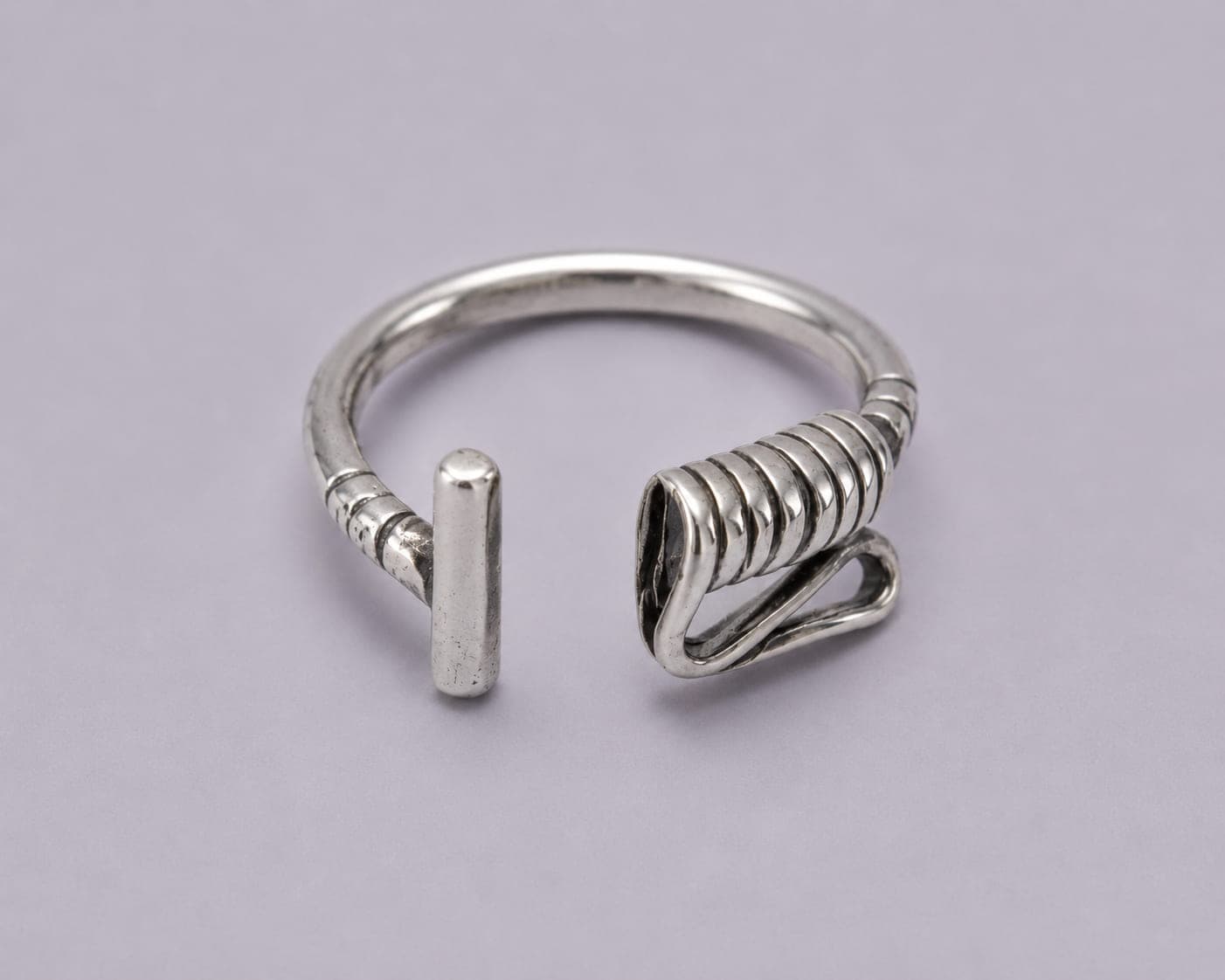 Handcrafted .925 sterling silver Polo Mallet wrap ring with an adjustable open design.