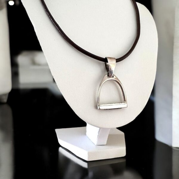 Sterling silver equestrian stirrup pendant on brown leather cord necklace
