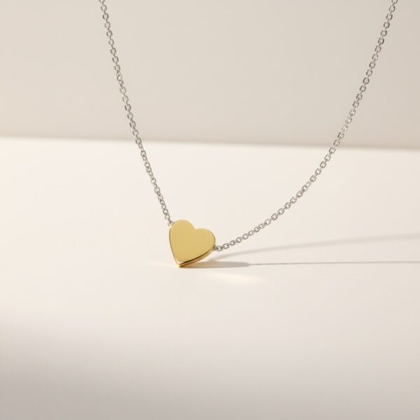 3D heart pendant gold side visible 18k gold and sterling silver